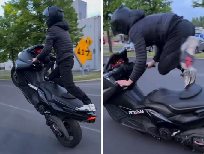Impennano in piedi sullo scooter, uno di loro cade ma continuano con le pericolose peripezie [VIDEO]